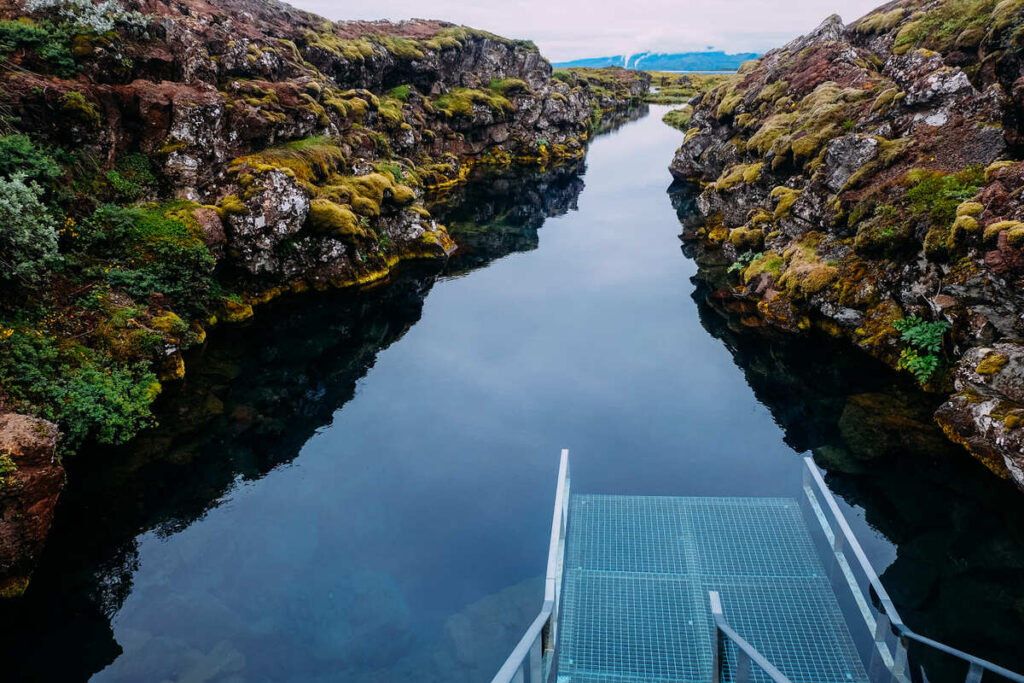 A metal descent platform into the water for diving in Silfra fissure at Thingvellir National Park in Iceland.