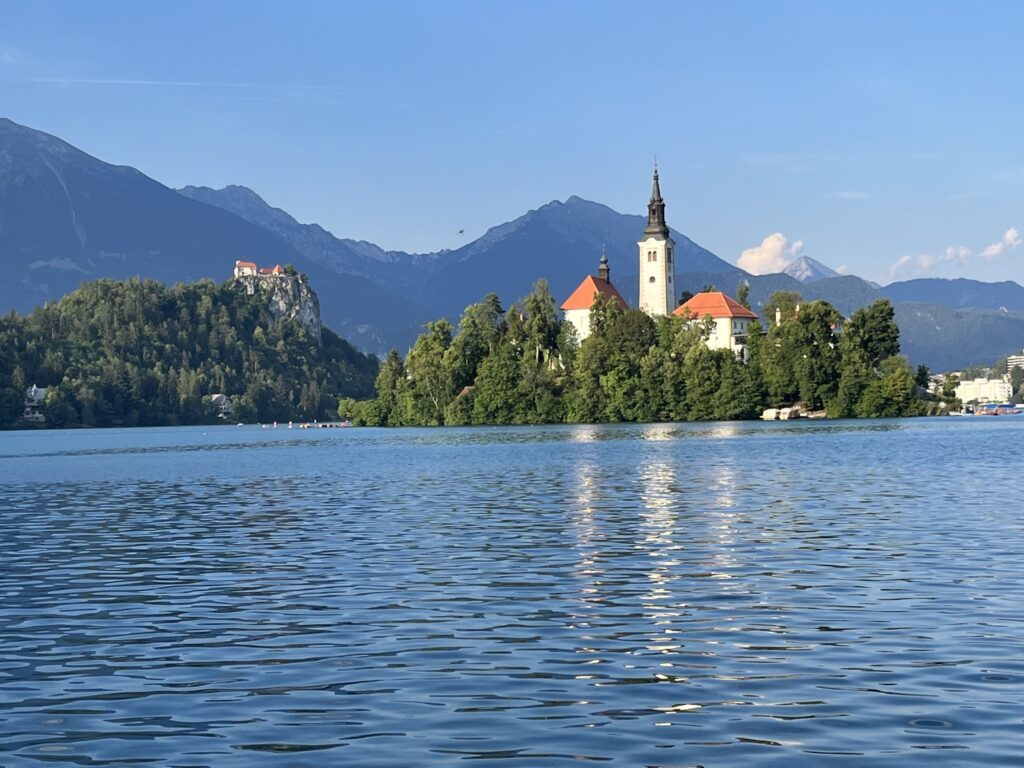 Lake with an island and a church in the background.