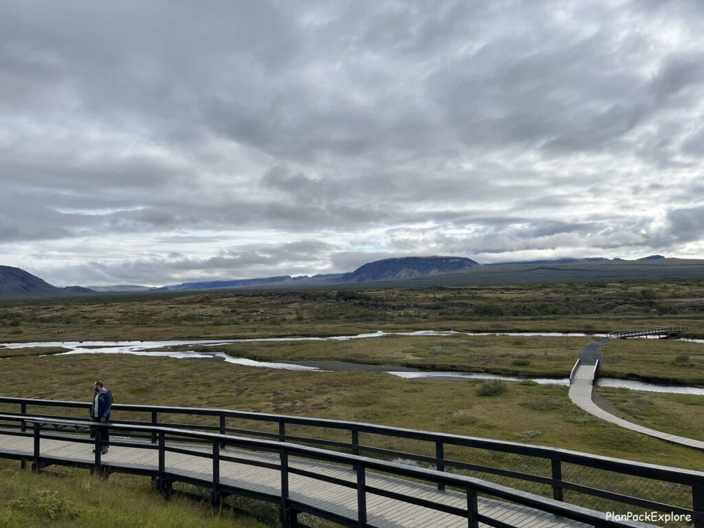 Wooden footbridges connecting two parallel trails of Thingvellir National Park.