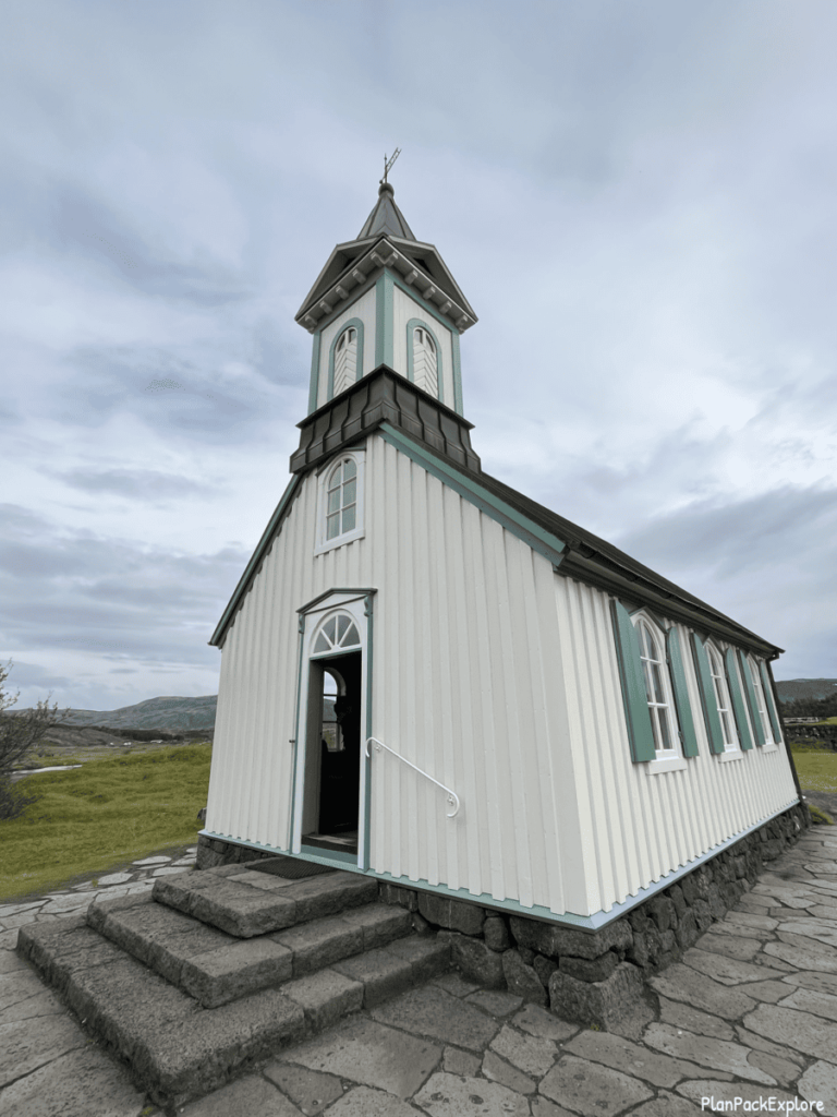 Thingvellir Church - a small white church with a green roof.