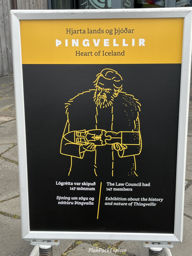 A stand-up sign advertising a historical exhibit inside the Thingvellir National Park Visitor center.