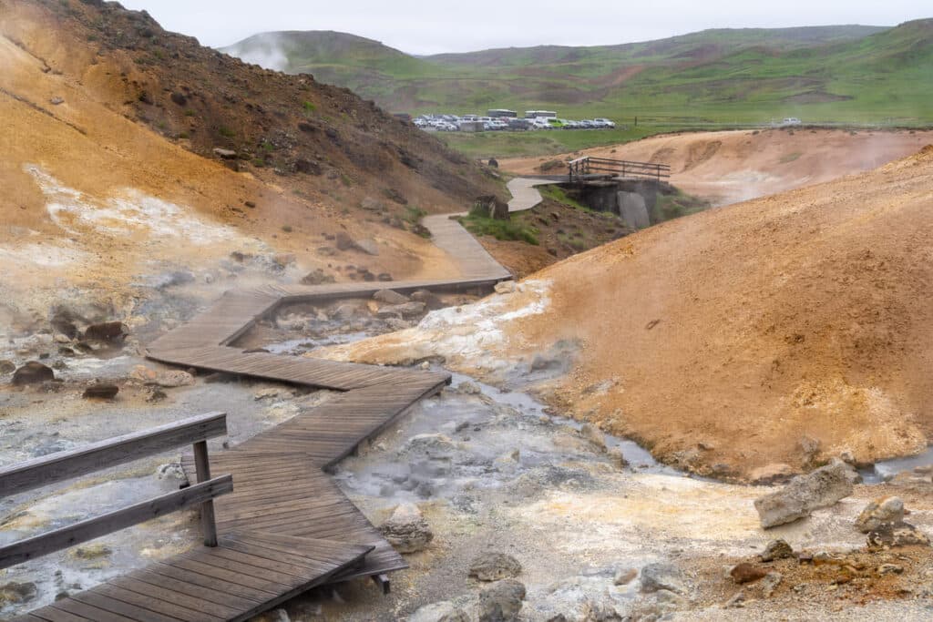 Seltun geothermal area at Reykjanes peninsula in Iceland. Steaming vents and multi-colored soil visible.
