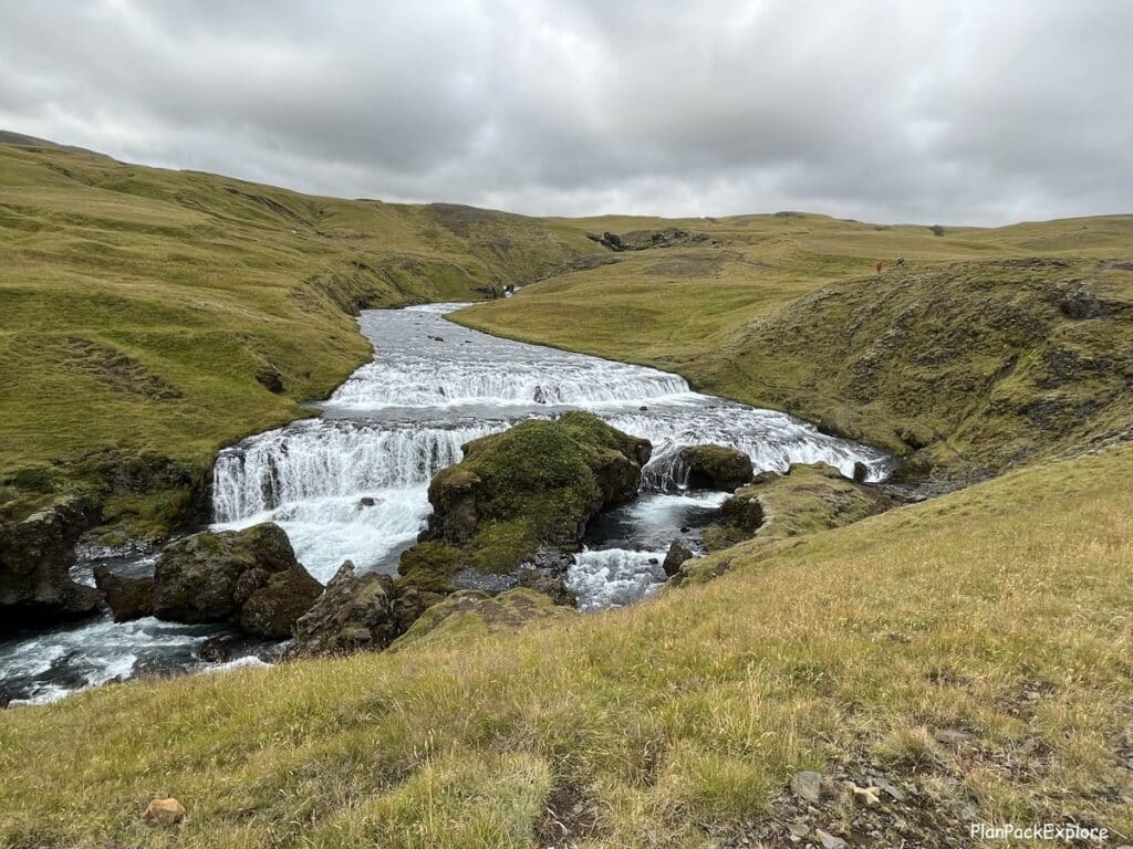 "Waterfall Way" trail at the top of Skogafoss Waterfall in Iceland. A path and a wide waterfall visible in the photo.