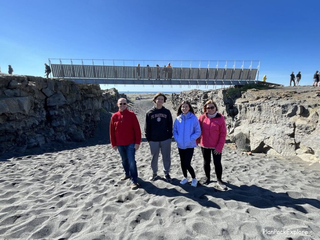 A family standing in front of the Bridge between the Continents.