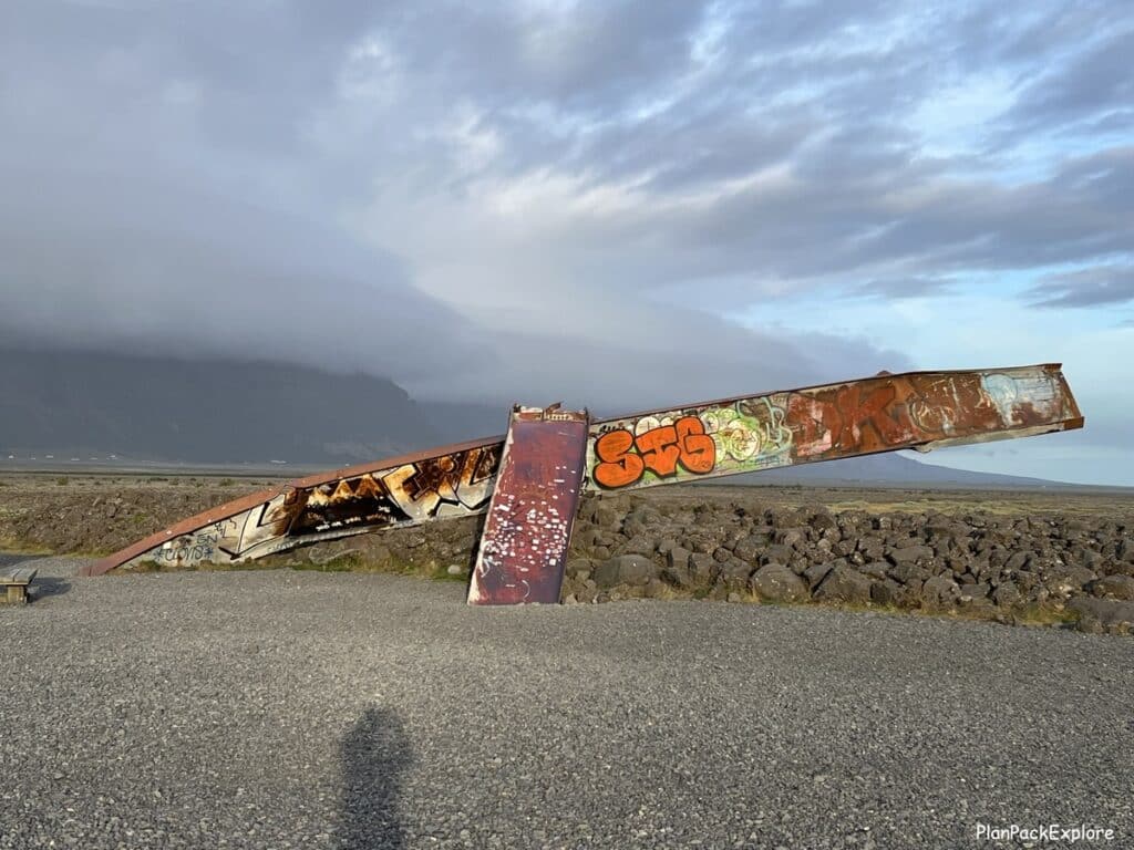 Remnants of Skeidara bridge in South Iceland - twisted metal covered in graffiti.