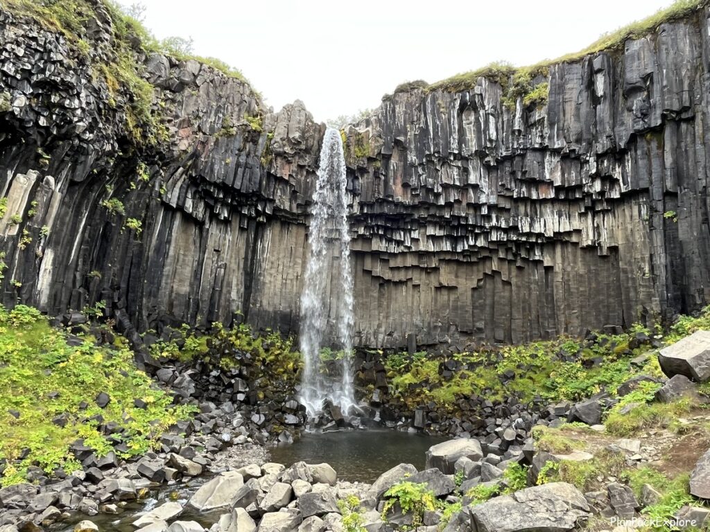 Svartifoss waterfall in Skaftafell National Park, Iceland - a waterfall inside a black basalt cove.