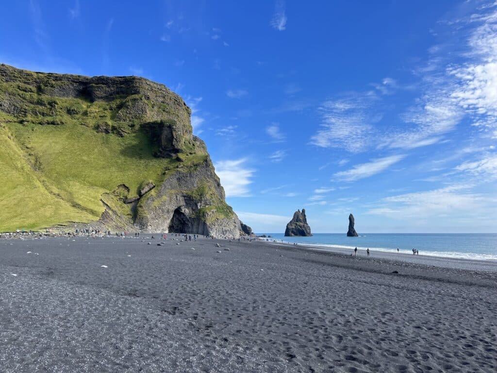 Reynisjfara Black Sand Beach and Reynisdrangar Sea Stacks in Iceland.