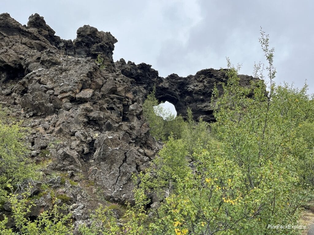 Dimmuborgir, Lake Myvatn, Iceland - a lava firld with large volcanic tructures and paths to walk around. A stone arch.