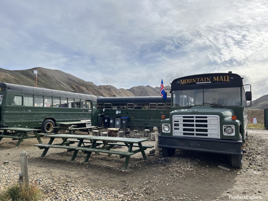 Landmannalaugar Mountain Mall - 3 green school buses selling snacks and drinks in Iceland - Highlands.