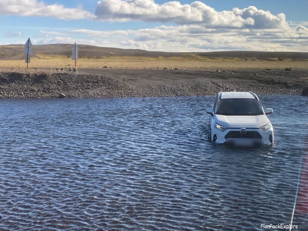 A car stuck in a river in Iceland.