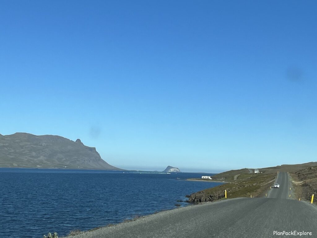 A main road in Iceland, with the ocean on the left side of the picture.