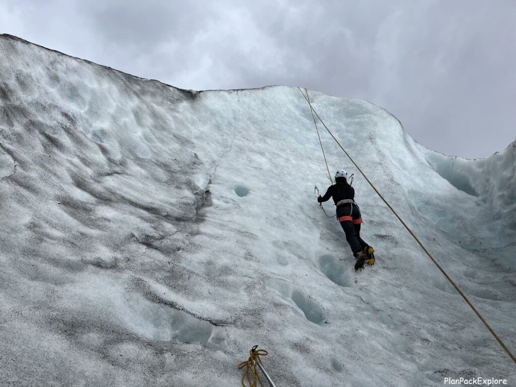 A person ice climbing on Vatnajokull glacier in Iceland.