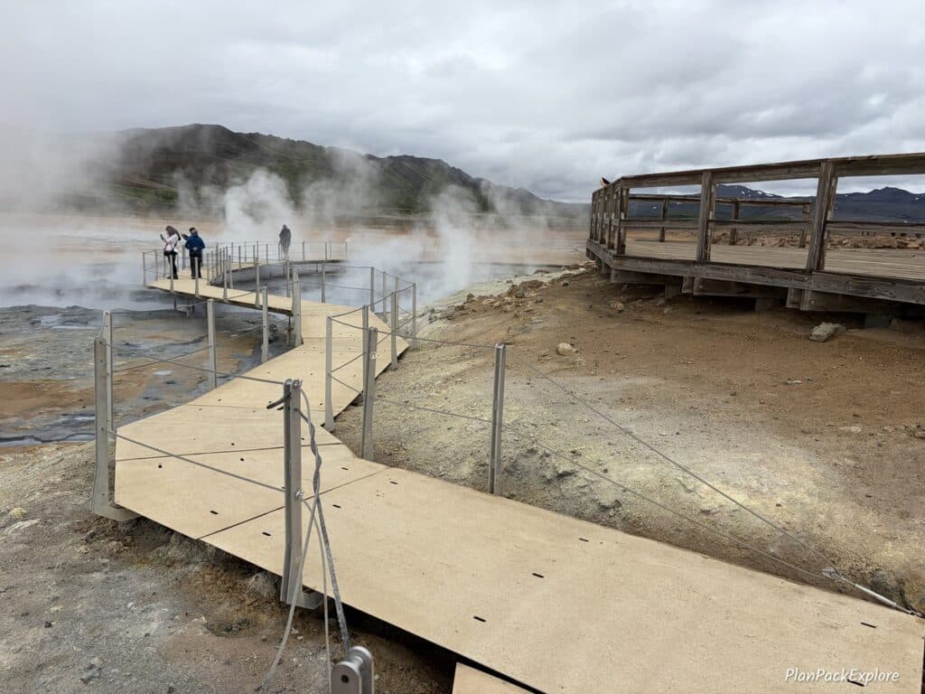 A wooden boardwalk along Hverir Geothermal Area in Iceland.