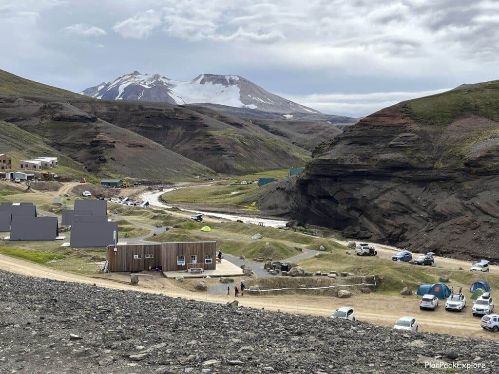 Highland Base at Kerlingarfjoll area in Iceland, showing the hotel, campsite and parking lots, with mountains in the background.