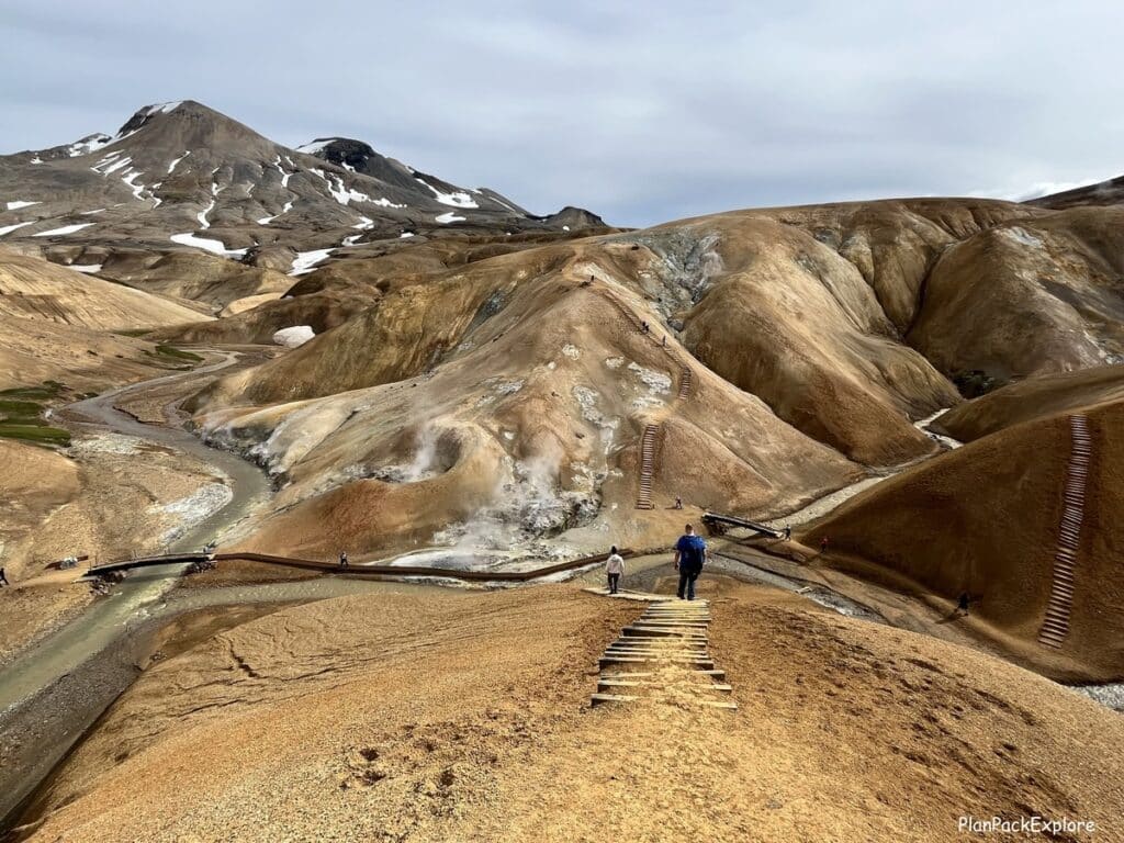 A view of paths and trails with built in steps of Hveradalir Geothermal valley, near Kerlingarfjoll, Iceland. Steaming vents in the background.