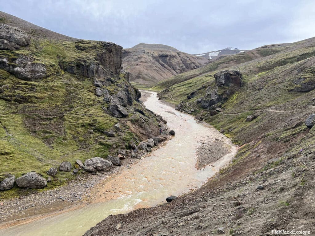 A narrow trail along a riverbank leading to the hot spring at Kerlingarfjoll, Iceland.