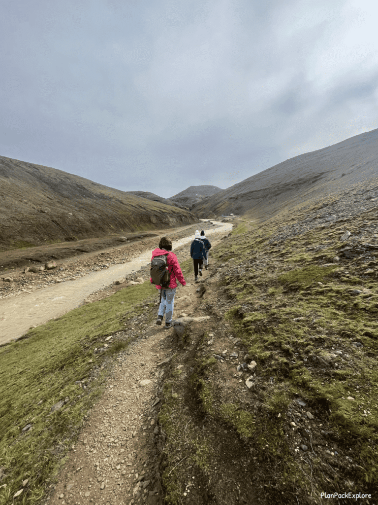 People on the narrow trail by the river leading to Kerlingarfjoll hot spring in Iceland.