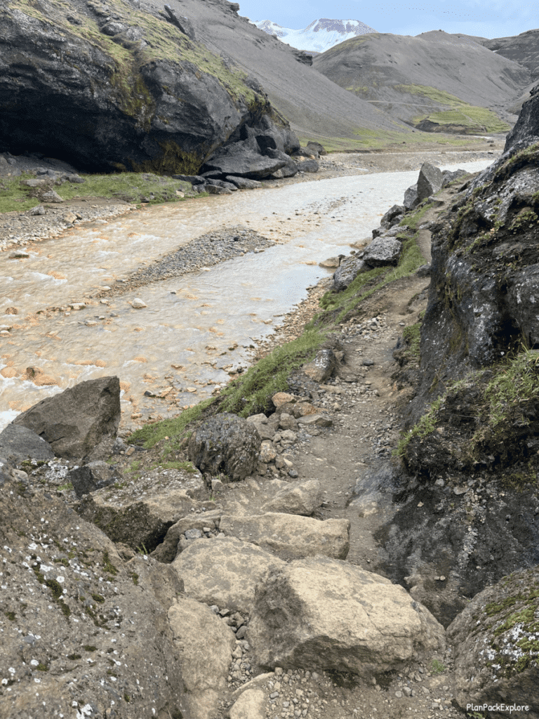 A narrow rocky trail by the river leading to Kerlingarfjoll hot spring in Iceland.