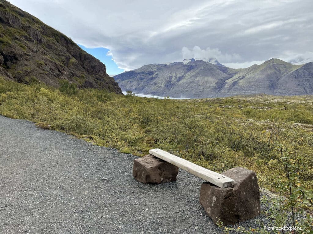 A bench made of two large stones and a piece of wood on the trail to Skaftafellsjokull glacier in Iceland.