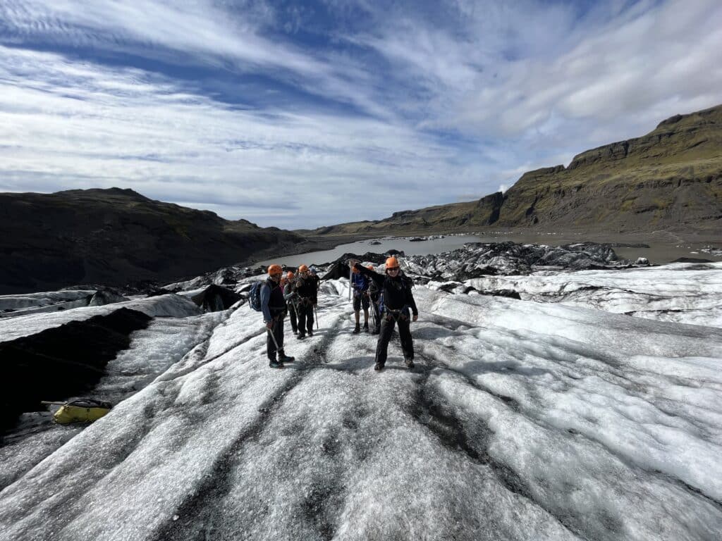 People standing on top of Solheimajokull glacier in Iceland.