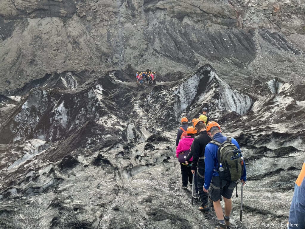 People on a glacier hike tour on Solheimajokull glacier in Iceland.