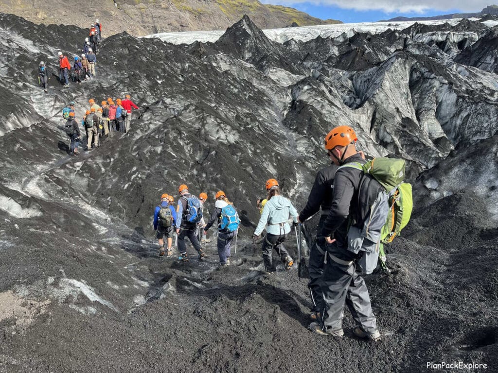 People hiking on Solheimajokull glacier in Iceland.