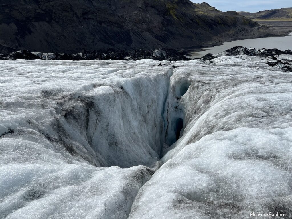 View of a Solheimajokull glacier crevasse from its top, captured during a glacier hike in Iceland.
