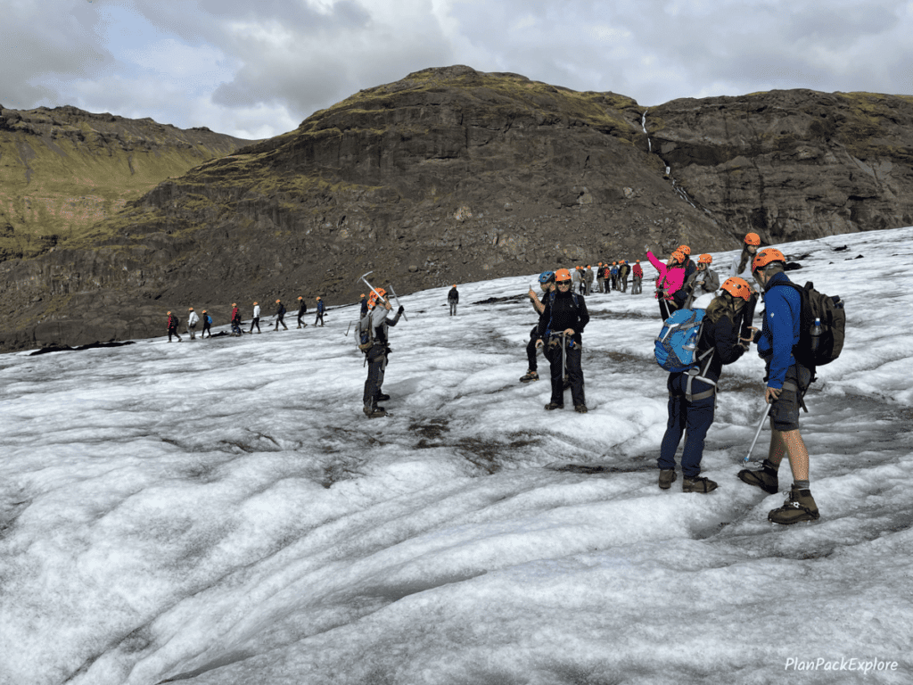 People standing on top of Solheimajokull glacier in Iceland.