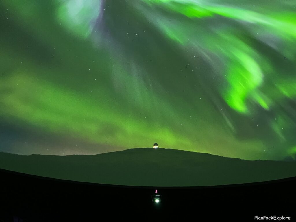 A picture of the Northern Lights (green) at the Aurora Planetarium Show at Perlan Museum in Reykjavik.