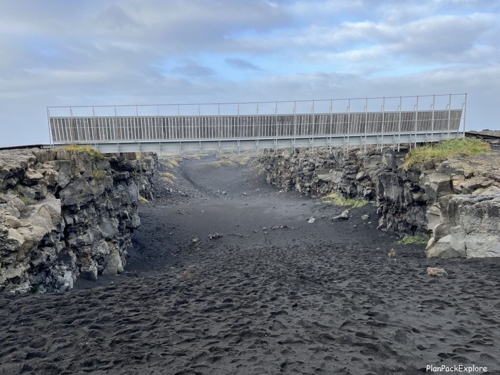 A metal bridge between the rocky tectonic plates in Iceland.