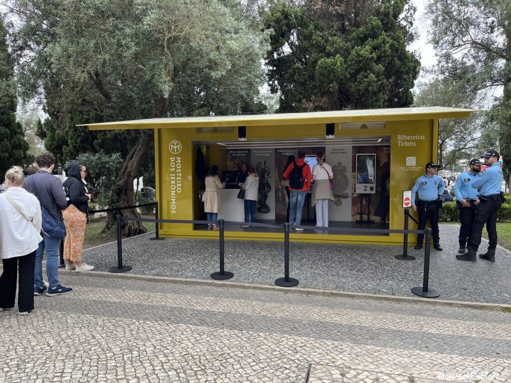 A yellow booth to purchase attraction tickets in Lisbon, Portugal.