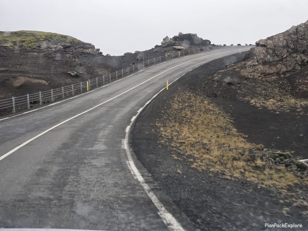 A paved uphill road in volcanic mountains of reykjanes peninsula in Iceland.