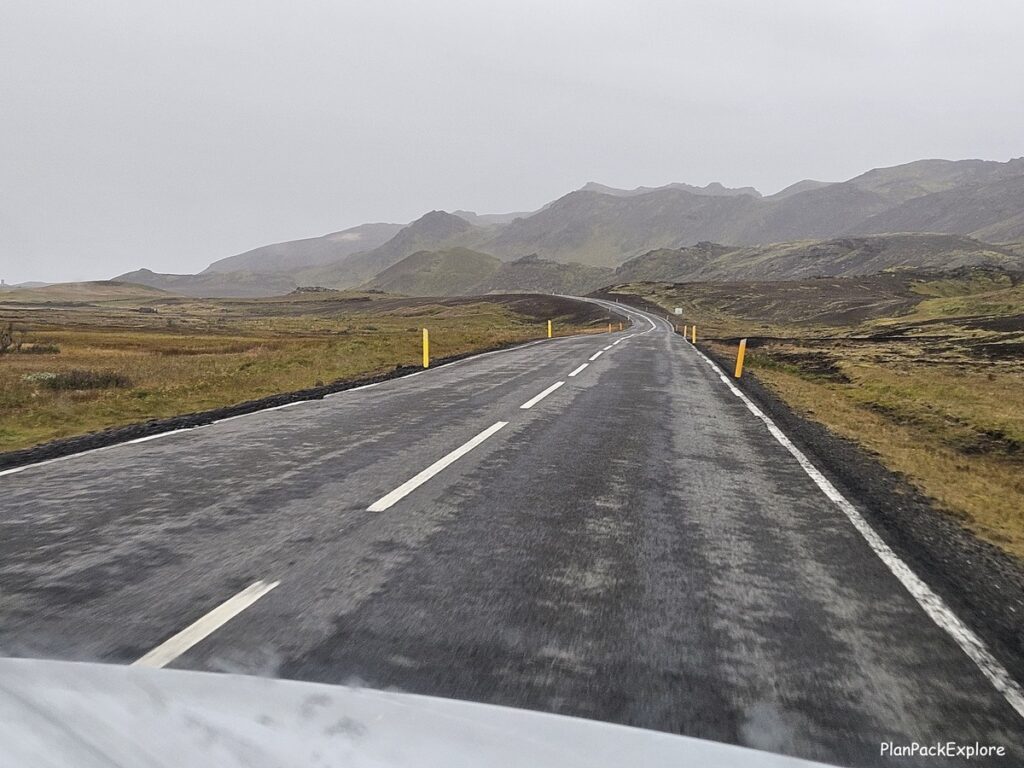 A paved road in volcanic mountains of reykjanes peninsula in Iceland.