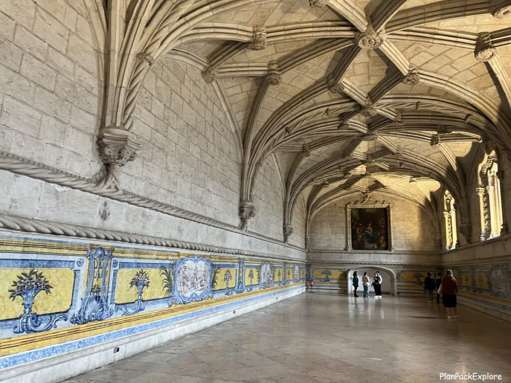 A view of the inside of the refectory with carved ceilings and tiled walls in Jeronimos Monastery, in lisbon.