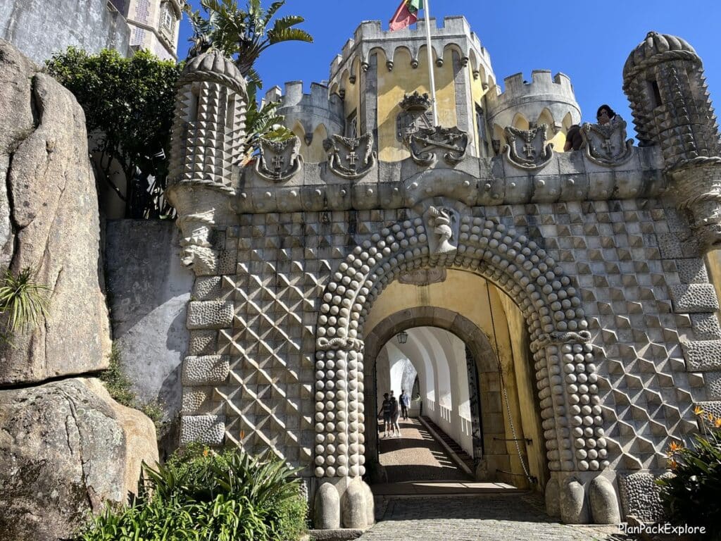 A carved arched stone gate to Pena Palace in Sintra Portugal.