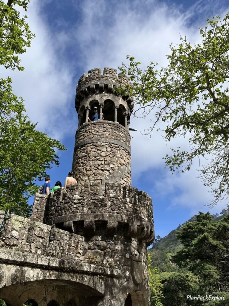 A small stone tower at quinta da regaleira in Sintra Portugal.
