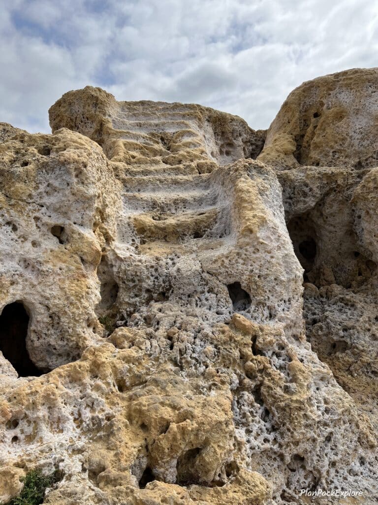 a stone staircase in the cliffs of algar seco in Portugal.