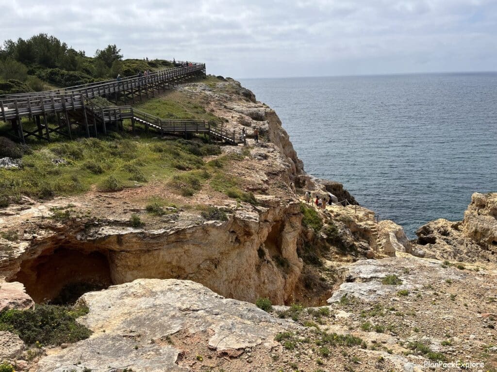 A staircacase from the wooden Carvoeiro boardwalk leading down to the base of the cliffs in the Algarve, Portugal.