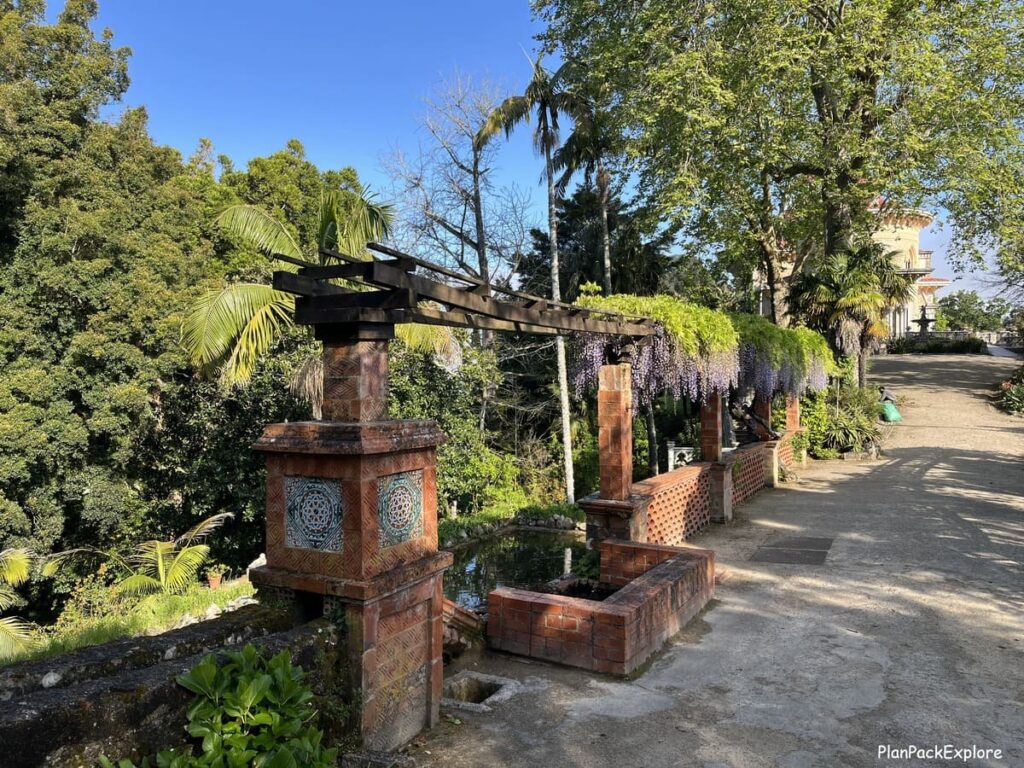 A trellis with purple hanging flowers near Monserrate palace in Sintra portugal.