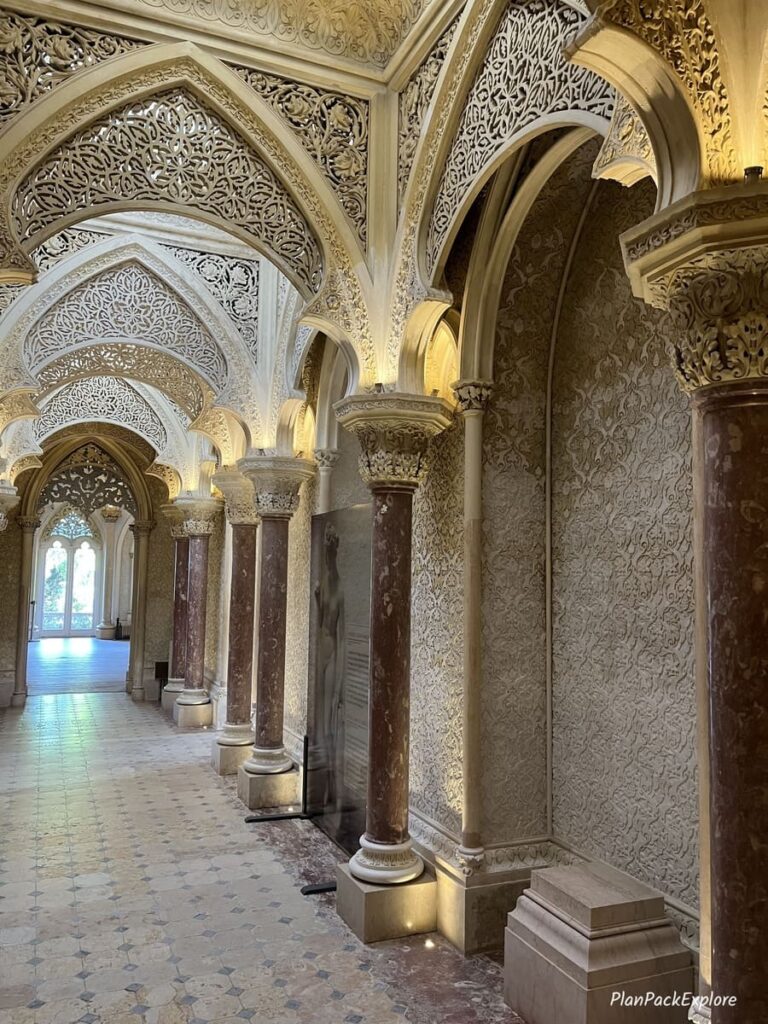 An arched hallway with carvings, inside monserrate palace in sintra portugal.