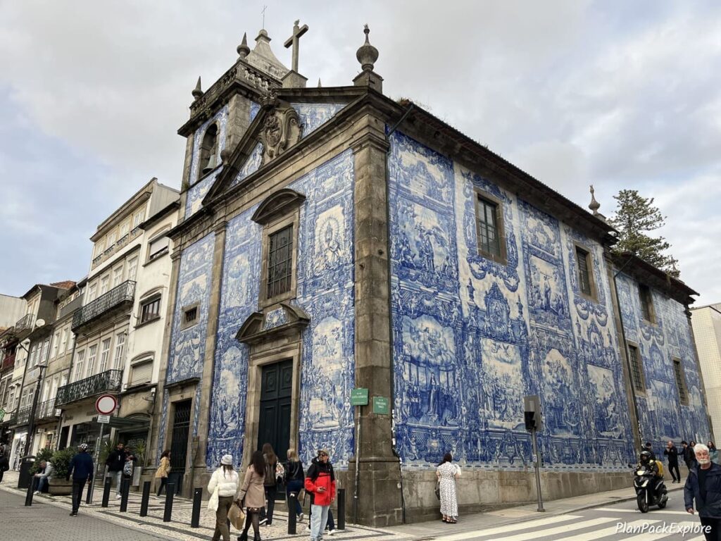 A small church decorated with blue azulejo tiles in Porto, Portugal.