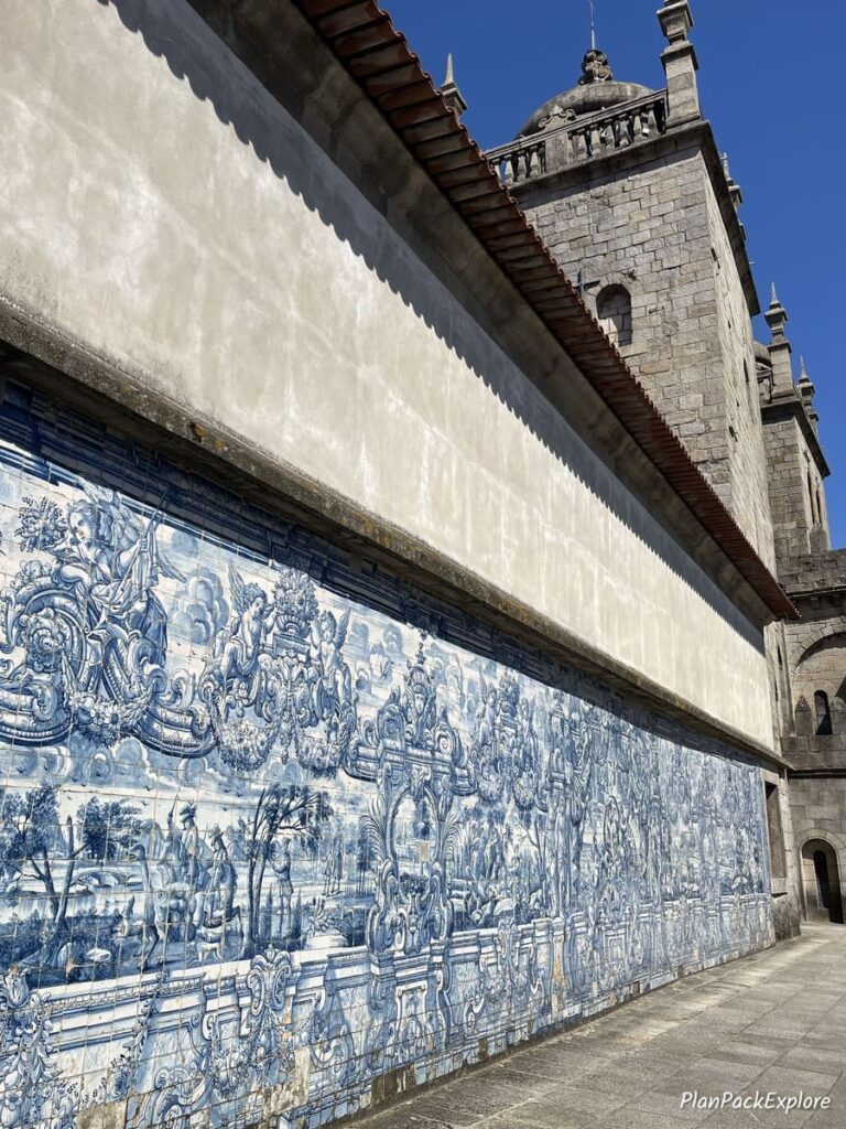 A long wall covered by the azulejo mural at the Porto cathedral.