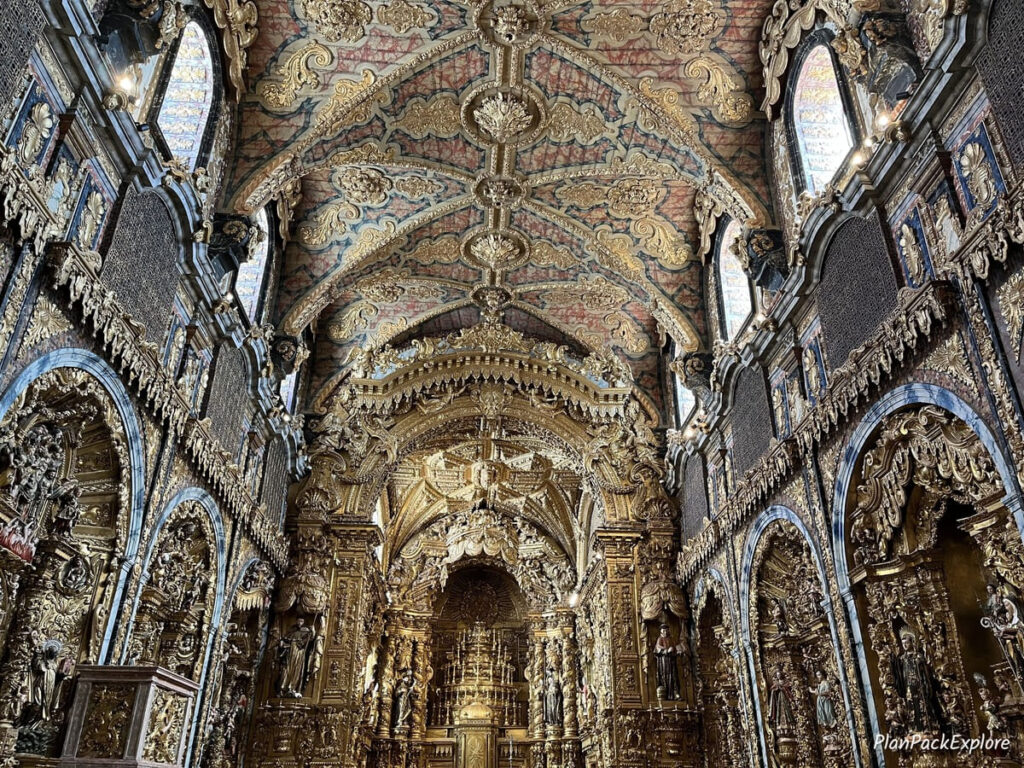 Inside of the ornate, gold-decorated church of Santa Clara in Porto.