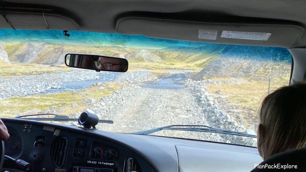 A gravel road viewed from the car window leading to laki Craters in Iceland.
