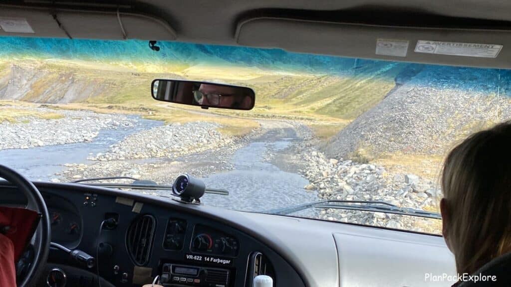 A shallow river crossing viewed from the car window on a gravel road leading to laki Craters in Iceland.