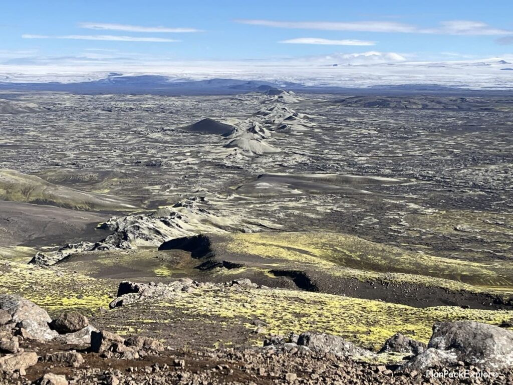 A row of moss-covered volcanic craters, called Laki Craters in Iceland.