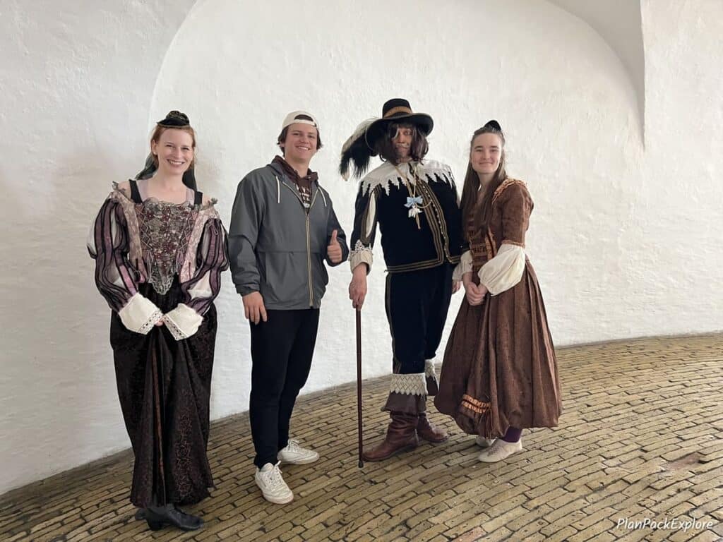 People dressed in royal costumes at the Round Tower in Copenhagen.