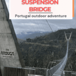 Image of the 516 Arouca Suspension Bridge in Portugal, featuring a long pathway suspended high above a valley, with mountains visible in the background.