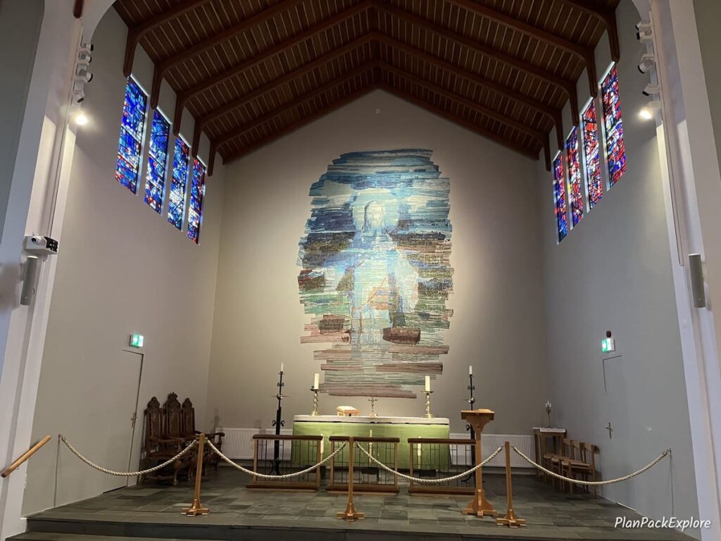 A colorful painted altar inside Skalholt Cathedral in Iceland.