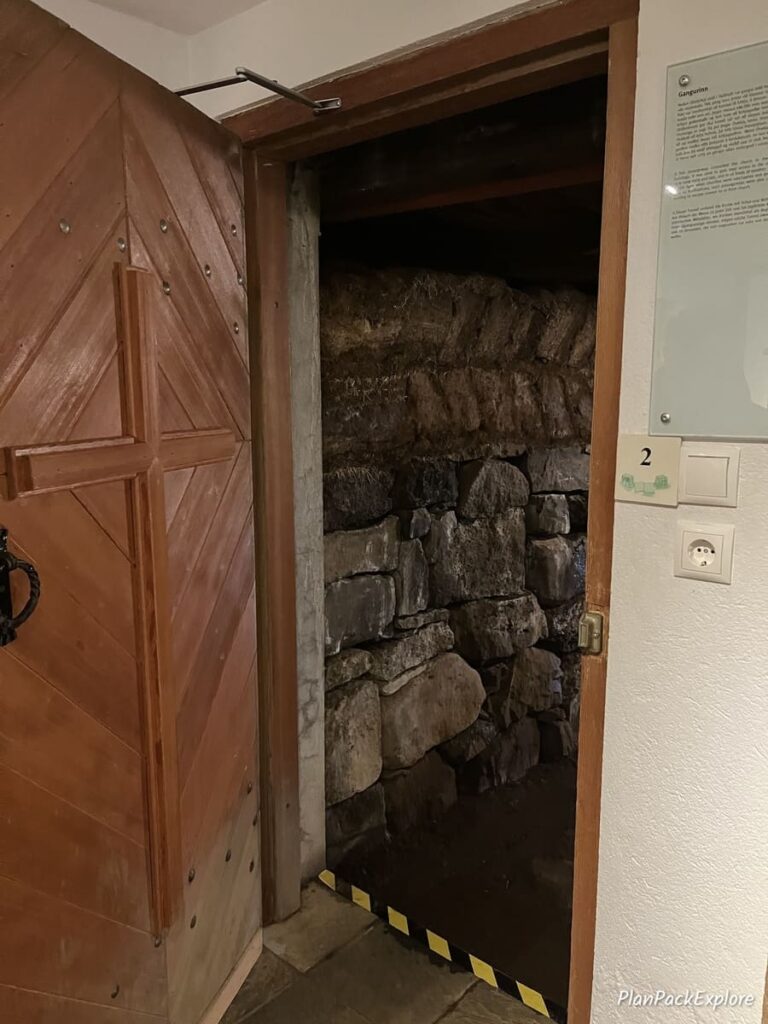 An open door leading to an underground tunnel at the Skalholt Cathedral in Iceland.